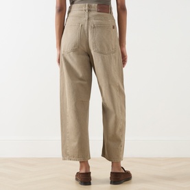 Model wearing Max Mara Weekend Arcadia Barrel-Leg Jeans in Beige Light, high-rise with barrel-leg fit, rear logo patch, styled with brown loafers