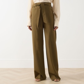 Model wearing Max Mara Main Editto Wide-Leg Trousers in khaki, high-rise with belt loops and wide full-length leg, styled with open-toe sandals