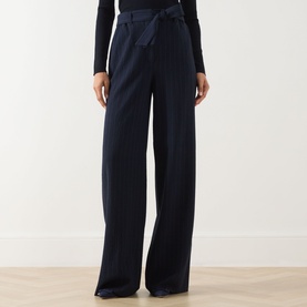 Model wearing Max Mara Main Lira Striped Wide Leg Trousers in ultramarine with tie waist belt, styled with a black long-sleeve top