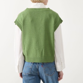 Model wearing Max Mara Weekend Alamaro Floral Knit Vest in Green Floral, back view, styled with white shirt and blue jeans