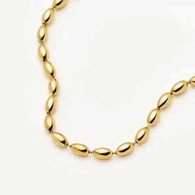 Missoma gold oval bead chain bracelet, polished yellow gold-tone links on white background