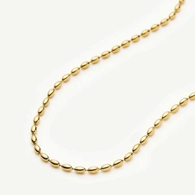 Missoma gold oval bead chain necklace, polished yellow gold-tone links on white background