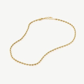 Missoma gold oval link chain necklace with lobster clasp fastening, lying flat on white background