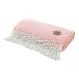 The Lyndon Company Arcadia Throw in Rose, soft pink woven textile with white knotted fringe trim and branded badge detail.