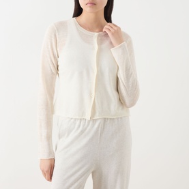 Model wearing AMERICAN VINTAGE Epaky Fine-Knit Cropped Cardigan in ecru, styled with matching wide-leg trousers