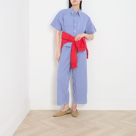 Model wearing American Vintage shirt in Vichy Bleu stripe, styled with matching wide-leg trousers, red tied jacket, and tan loafers