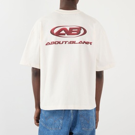 Model wearing About:Blank Oblique Logo T-Shirt in oat, rear view showing burgundy logo print, styled with blue jeans