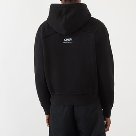 Model wearing About:Blank Arc Logo Hoodie in black, shown from behind, with small logo print at centre back and dropped shoulders.