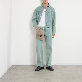 Model wearing About:Blank murky wash jeans in light teal, styled with matching denim jacket, white tee, and black loafers.