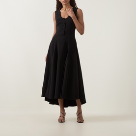 Model wearing Anne Louise Boutique black sleeveless midi dress with button-front bodice and flared skirt, styled with strappy heeled sandals.