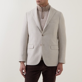 Model wearing Boglioli beige wool blend blazer jacket, styled with a grey roll neck and dark brown trousers.
