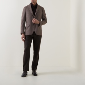 Model wearing Boglioli beige wool jacket with black turtleneck, dark trousers and black leather shoes.