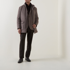 Model wearing Boglioli beige wool jacket with chest patch pockets, styled with dark trousers and black leather shoes.