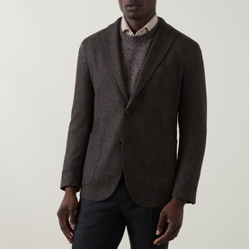 Model wearing Boglioli brown wool-blend blazer jacket, styled with grey knit sweater and dark trousers