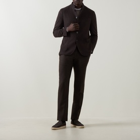 Model wearing Boglioli brown wool cashmere blend jacket with matching trousers, white crew-neck tee and dark suede loafers