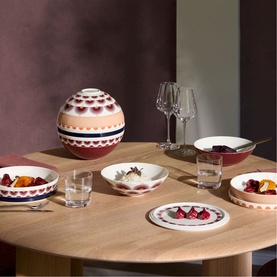 Villeroy & Boch Iconic La Boule Kyoto dinnerware set styled on oak table, featuring multicoloured patterned bowls and plates in porcelain