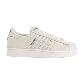 Adidas Superstar trainers in off-white leather with three stripe detailing, shell toe, and white sole with carbon accent