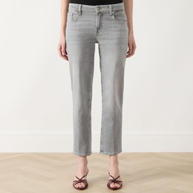 Model wearing grey cropped straight-leg jeans with faded wash, styled with red strappy heeled mules