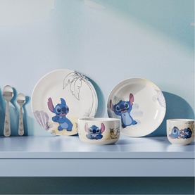 Villeroy & Boch Disney Stitch metallic 4-piece cutlery set styled with matching Stitch dinnerware including plates, bowls and mugs