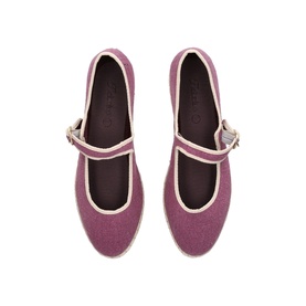 Overhead view of purple canvas Mary Jane flats with cream trim, single buckle strap, and flat sole