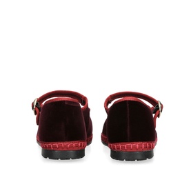 Flabelus red velvet flat shoes, rear view showing ankle strap with gold buckle and contrast stitched black rubber sole
