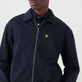 Model wearing Lyle & Scott Eagle Logo Overshirt in Dark Navy, zip fastening, gold eagle logo, styled with navy shirt underneath
