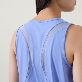 Model wearing Spanx Active Top in Hyacinth, back view showing mesh panel detail on sleeveless design