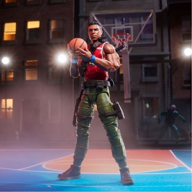 Superheroes multi-coloured action figure holding basketball, dressed in red vest and green cargo trousers, set against a night-time basketball court