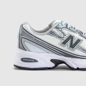 New Balance 1906 trainer in white and castlerock metallic, silver mesh upper, ABZORB midsole, white outsole, angled detail view