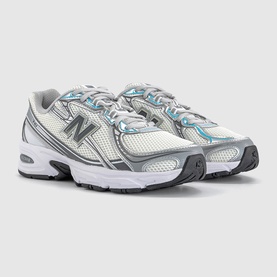 New Balance 740 trainers in white and castlerock metallic with blue mesh detailing, silver overlays and light grey rubber sole