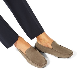 Model wearing KG by Kurt Geiger brown suede loafers with moccasin toe stitching, styled with navy tailored trousers