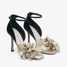 Jimmy Choo white and black satin stiletto sandals with oversized bow detail, ankle strap, and slim heel