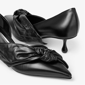 Jimmy Choo black leather pointed-toe kitten heel pumps with oversized knotted bow detail, sculptured heel, close-up detail shot