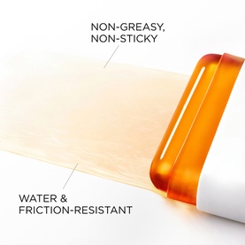Lanc&ocirc;me UVEX Supra Screen Stick SPF50 shown gliding on skin, highlighting non-greasy, non-sticky and water and friction-resistant formula.