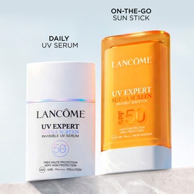 Lancome UV Expert Supra Screen Stick SPF50 sun stick alongside UV Expert Invisible UV Serum SPF50, both in white and amber packaging