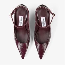 Jimmy Choo deep merlot patent croc-effect pointed-toe heels with gold-tone ankle strap buckle, top-down view