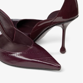 Jimmy Choo deep merlot patent leather pointed-toe stiletto heels, close-up showing sculpted heel and d'Orsay cut detail