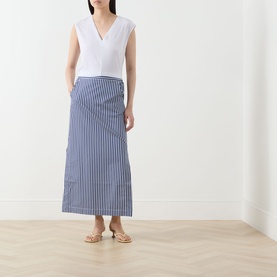 Model wearing Selected Femme Berta Stitched Tank Top in Bright White with blue striped midi skirt and gold flat sandals.