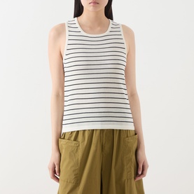 Model wearing Selected Femme Moon Striped Knitted Vest in Birch/Black Stripes, styled with olive wide-leg trousers