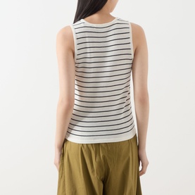 Model wearing Selected Femme Moon Striped Knitted Vest in Birch/Black Stripes, sleeveless with ribbed trim, styled with olive wide-leg trousers. Back