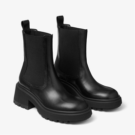 Jimmy Choo black leather Chelsea boots with elastic side panels, block heel, and chunky lug sole