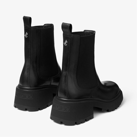 Jimmy Choo black leather Chelsea boots with chunky lug sole and elasticated side panels, rear view.