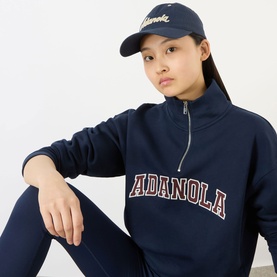 Model with Adanola Signature Appliqu&eacute; Logo Baseball Cap in navy, curved brim, worn with matching navy half-zip sweatshirt