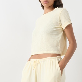 Model wearing Adanola ButterCream cotton crop T-shirt, styled with matching drawstring wide-leg trousers.