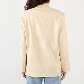 Model wearing Anine Bing Quinn Single-Breasted Blazer in butteryellow, rear view showing padded shoulders and clean tailored back seam.