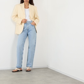 Model wearing Anine Bing Quinn Single-Breasted Blazer in butter yellow, styled with light-wash straight-leg jeans and flat sandals.