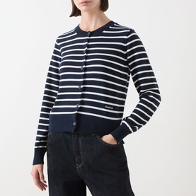 Model wearing Barbour Baiton Striped Cardigan in Dark Navy Stripe, round neck, button front, styled with dark jeans.