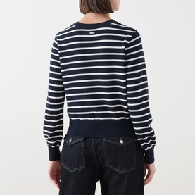 Model wearing Barbour Baiton Striped Cardigan in Dark Navy Stripe, back view, paired with dark denim jeans
