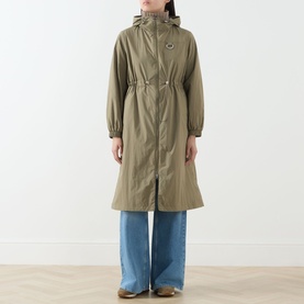 Model wearing khaki hooded longline parka with cinched waist and zip fastening, styled with wide-leg blue jeans