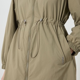 Model wearing khaki zip-up jacket with drawstring waist and elasticated cuffs, hand in side pocket